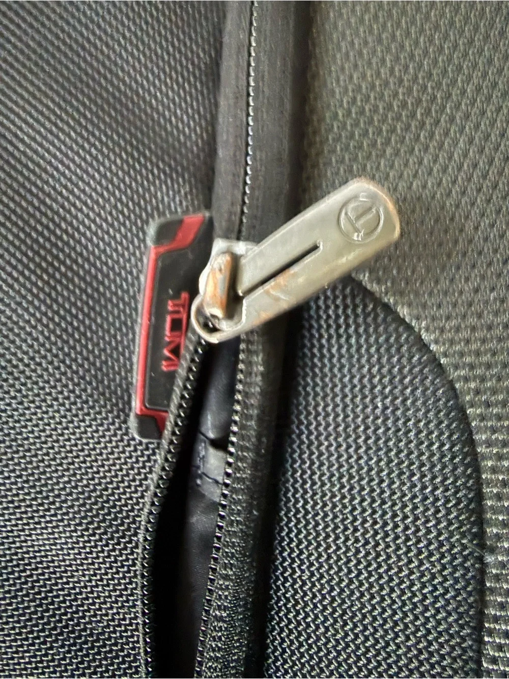 Tumi Black and Gray Rolling Carry-On